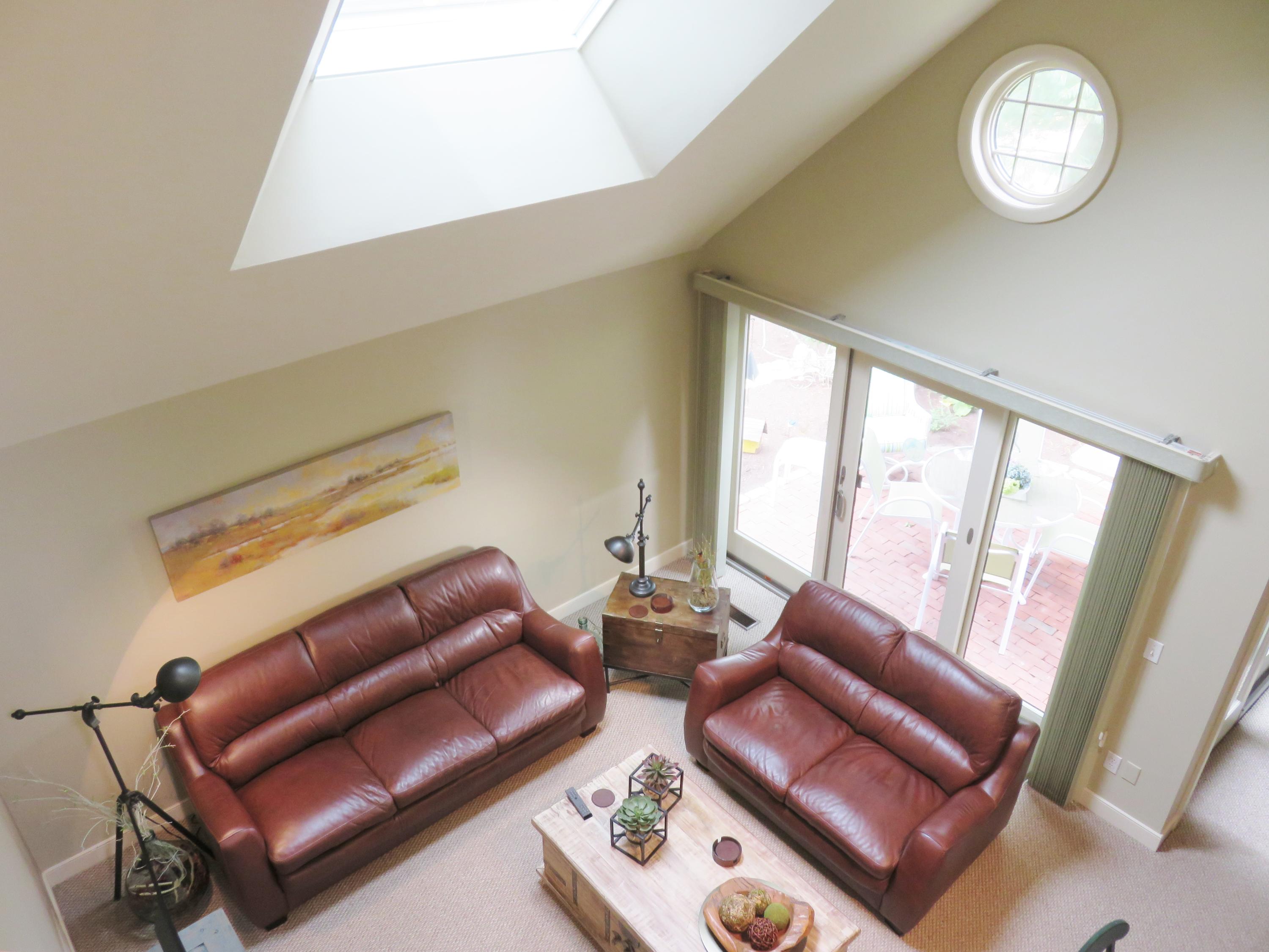 22 Mid-Iron Way, Unit 7509 Mashpee, MA 02649 - Photo 8 of 32 a living room with furniture a couch and large window