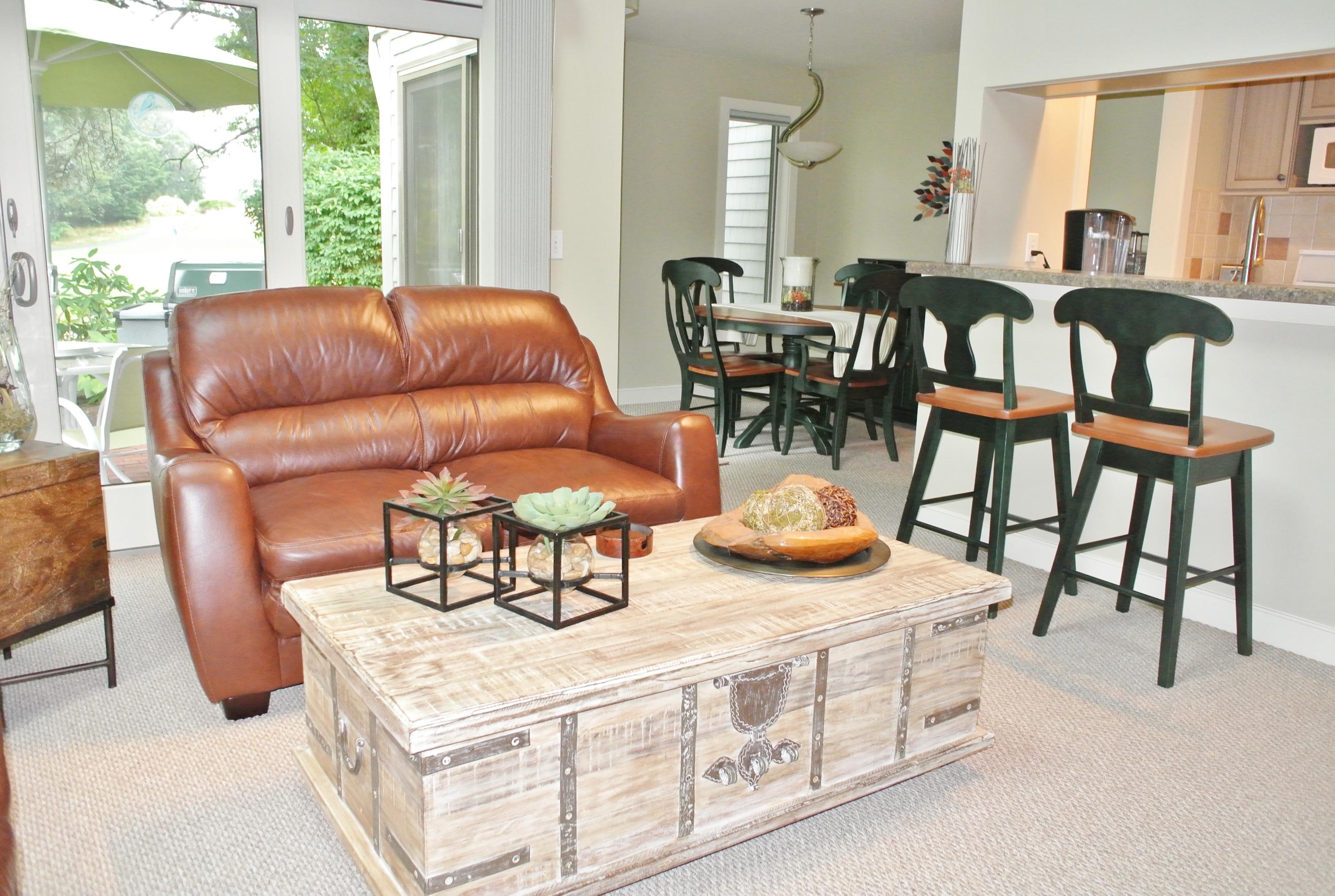 22 Mid-Iron Way, Unit 7509 Mashpee, MA 02649 - Photo 9 of 32 a living room with furniture and a large window