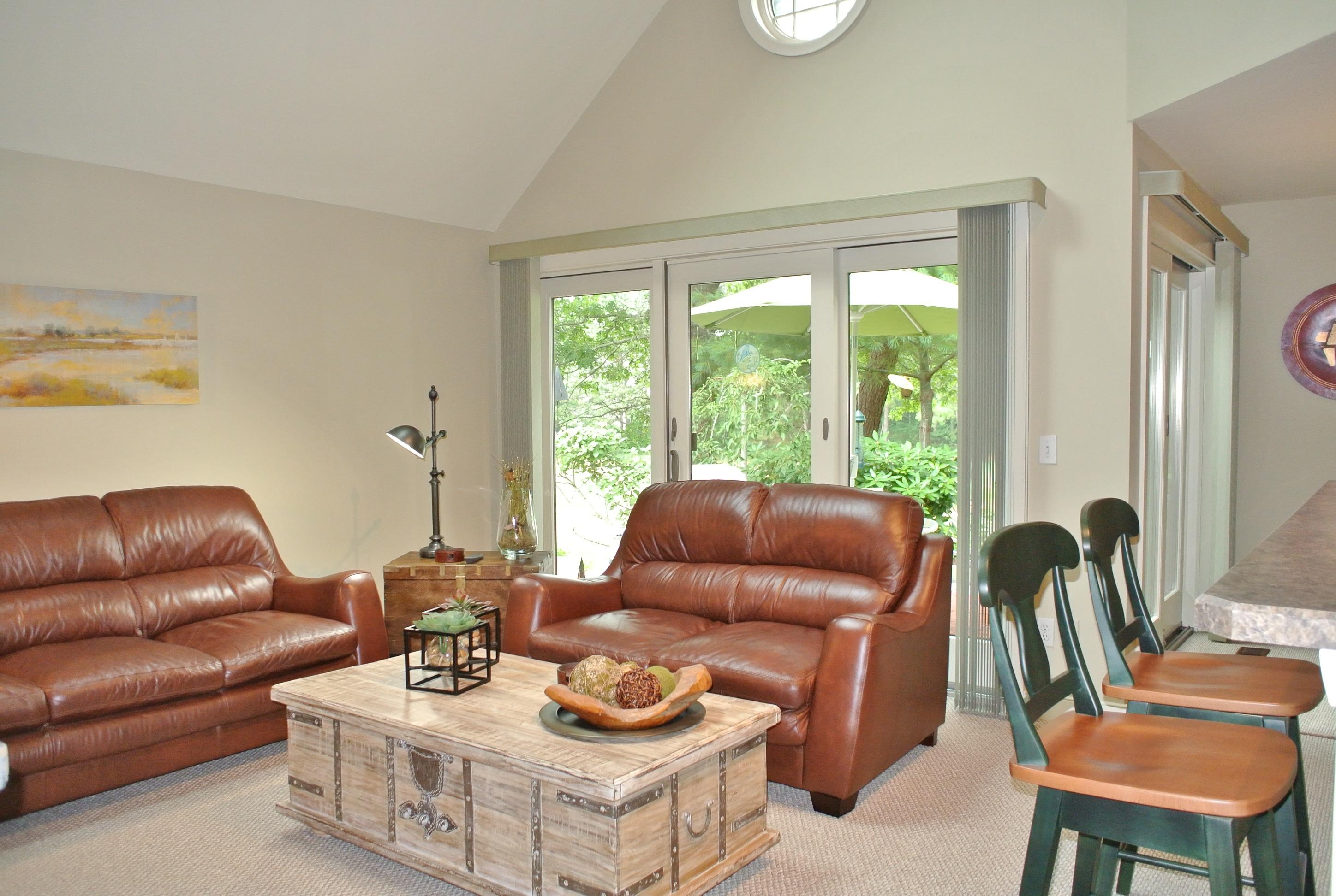 22 Mid-Iron Way, Unit 7509 Mashpee, MA 02649 - Photo 10 of 32 a living room with furniture and a large window