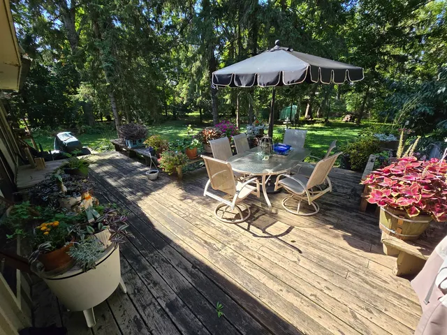 a view of a backyard with sitting area and furniture
