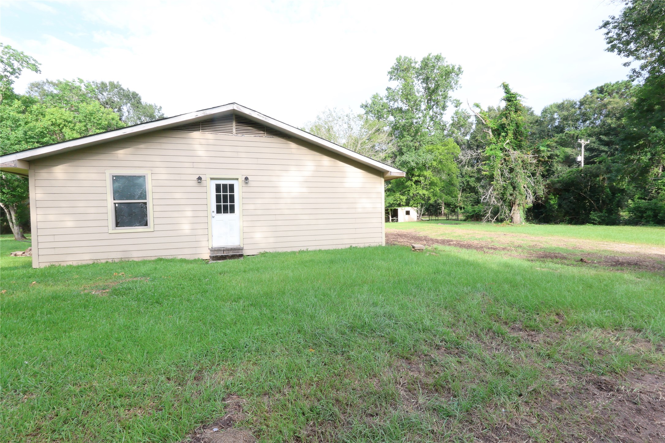21805 Baptist Encampment Road New Caney, TX 77357 - Photo 25 of 33 West-facing side yard