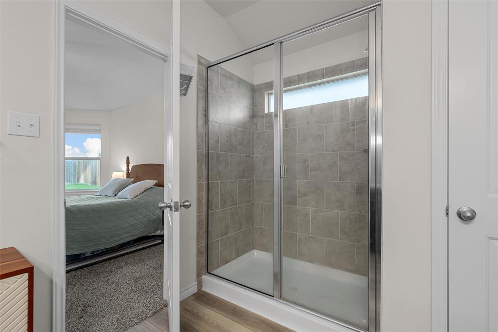 10712 Peperak Court Waco, TX 76708 - Photo 16 of 25 a en suite bathroom with a shower and a sink