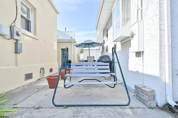 a view of a balcony with chairs