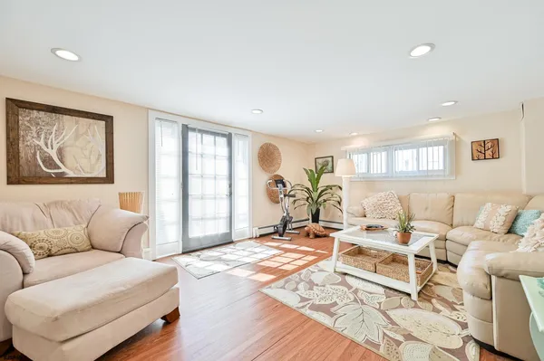 a living room with furniture or couch and a window