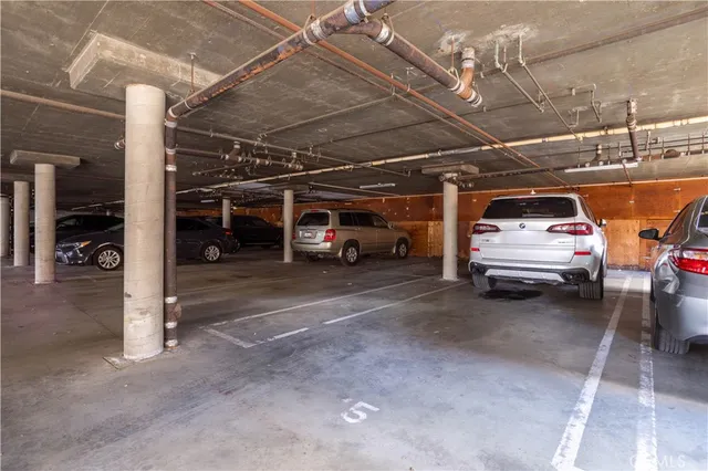a view of parking garage with cars
