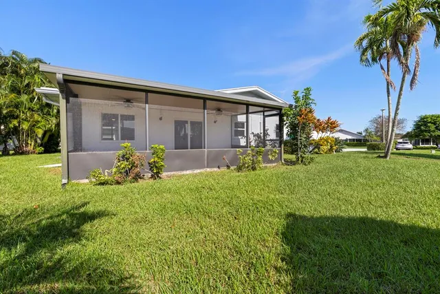 an aerial view of a house with outdoor space