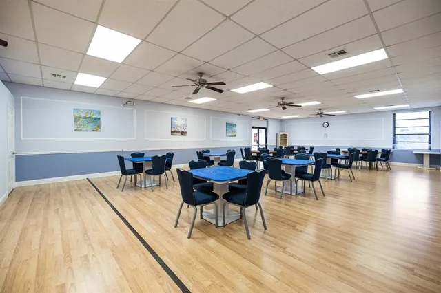 a room with lots of furniture and a chandelier