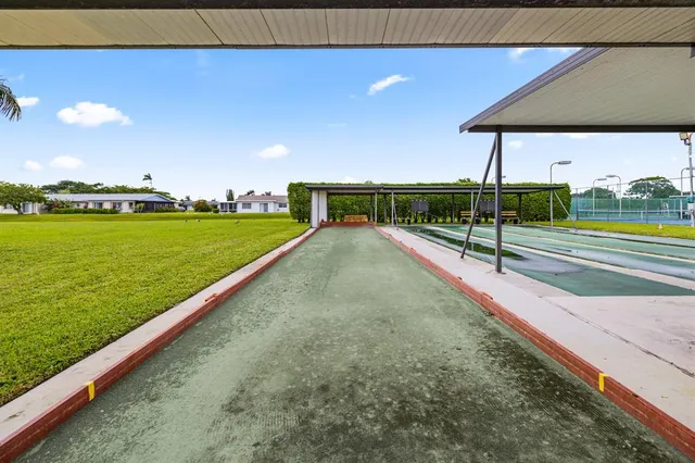 a view of an outdoor space and basketball court