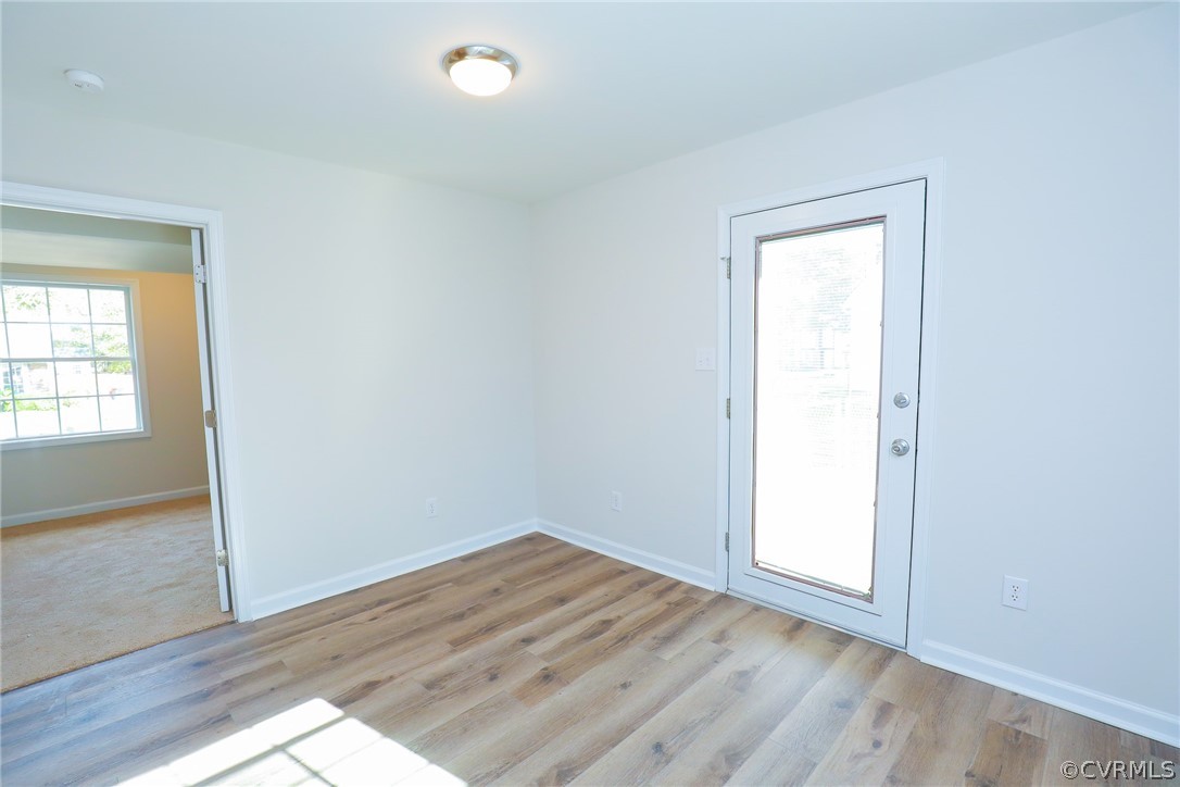 6029 Barrister Road Chesterfield, VA 23832 - Photo 24 of 50 an empty room with wooden floor and windows