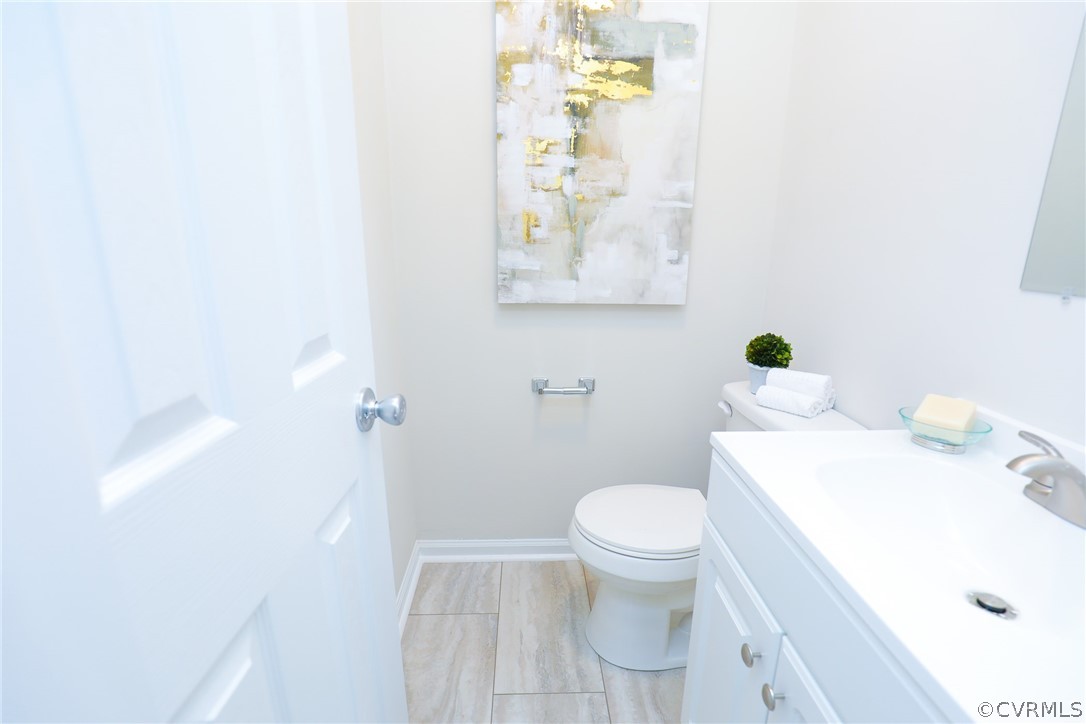 6029 Barrister Road Chesterfield, VA 23832 - Photo 36 of 50 a white toilet sitting next to a bathroom sink