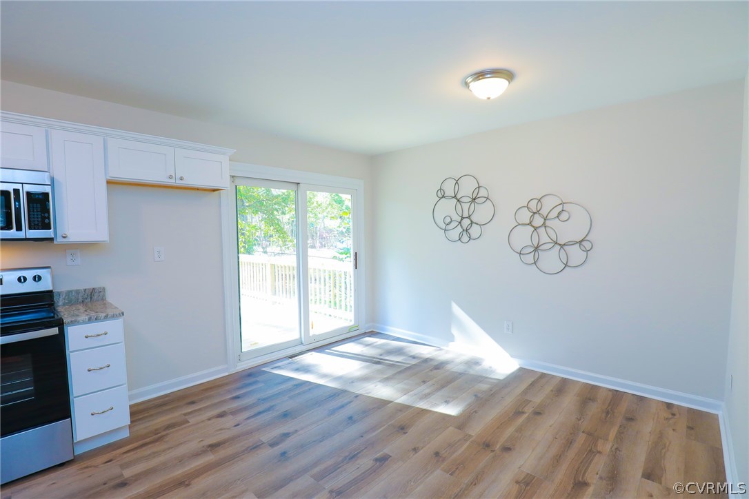 6029 Barrister Road Chesterfield, VA 23832 - Photo 8 of 50 a view of empty room with window and wooden floor