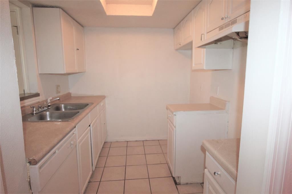 8003 Rothington Road, Unit 53 Dallas, TX 75227 - Photo 2 of 11 a bathroom with a sink a toilet and vanity