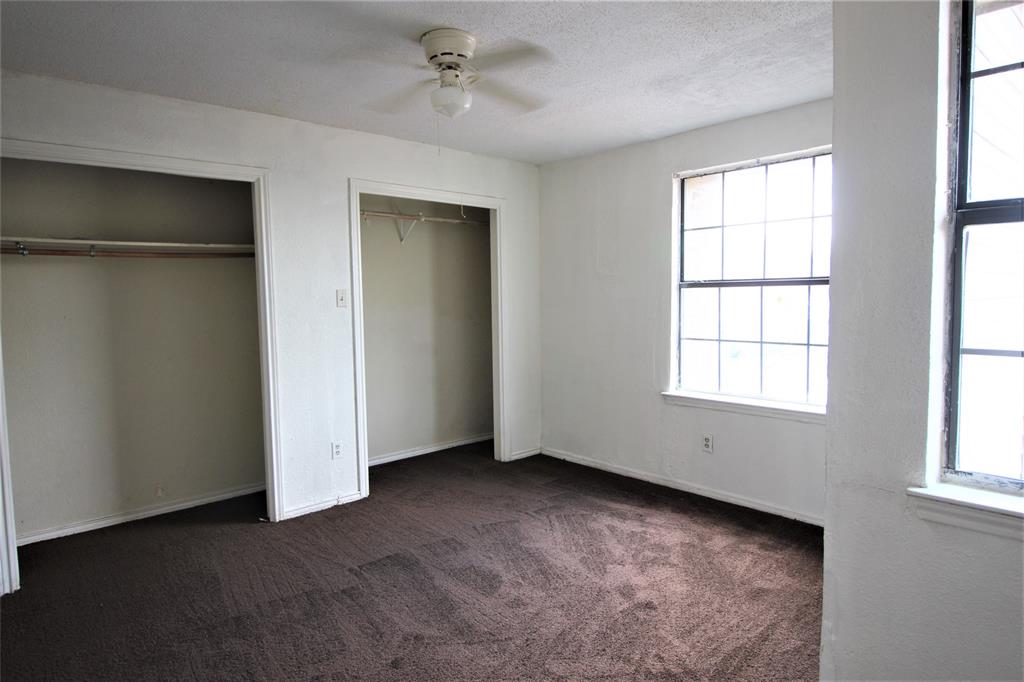 8003 Rothington Road, Unit 53 Dallas, TX 75227 - Photo 7 of 11 a view of an empty room with a window
