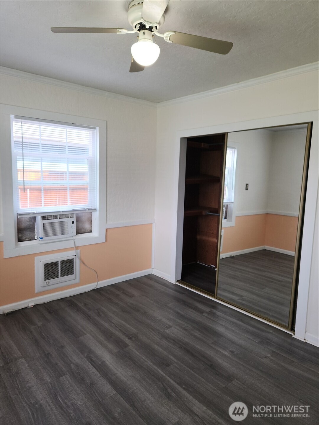 2902 Dover Street Longview, WA 98632 - Photo 21 of 23 a view of an empty room with a window and wooden floor