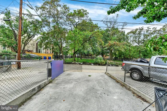 a view of a yard with a house and a park