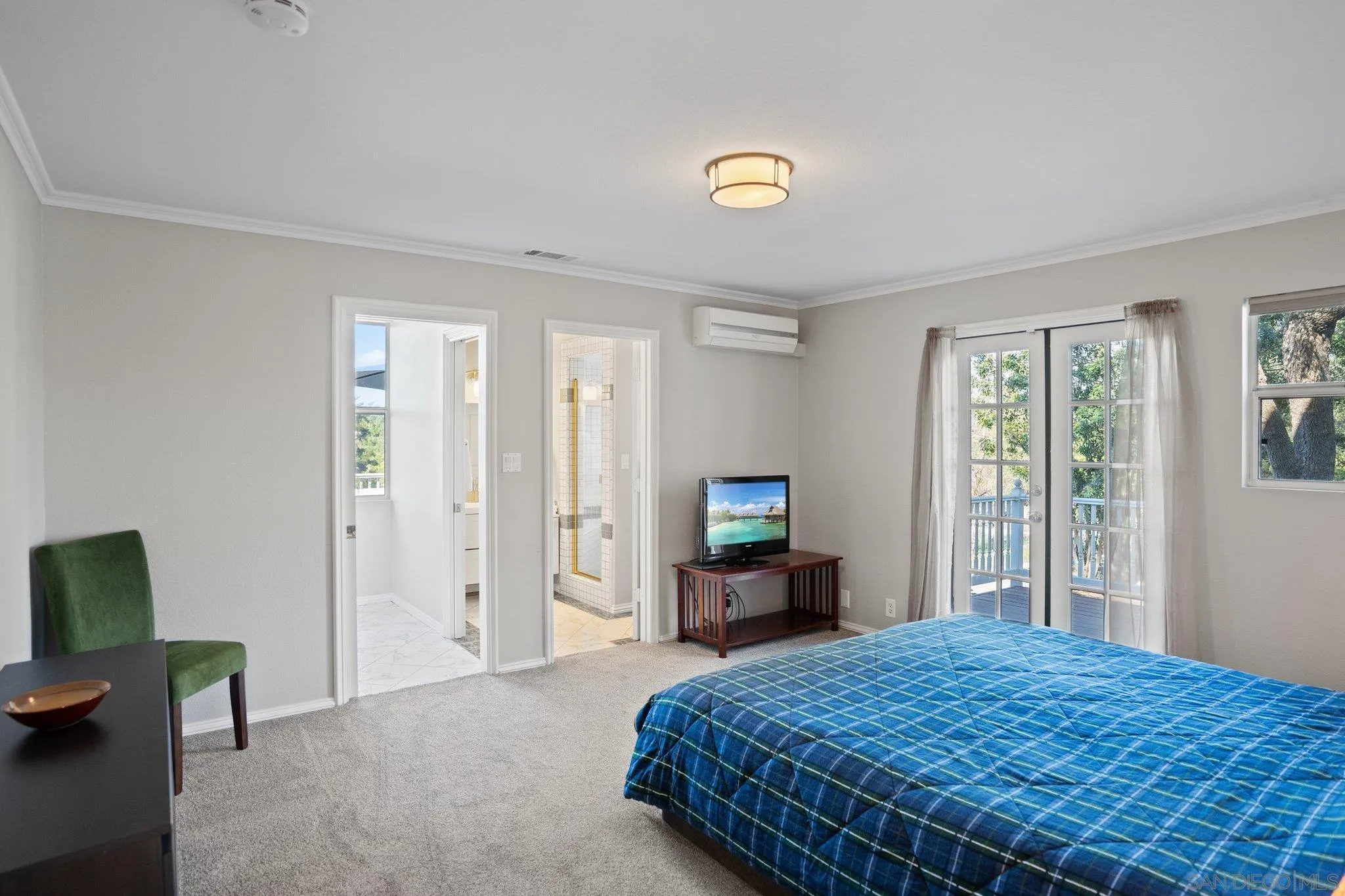 1267 Palomino Road Fallbrook, CA 92028 - Photo 12 of 34 a bedroom with a bed and a television