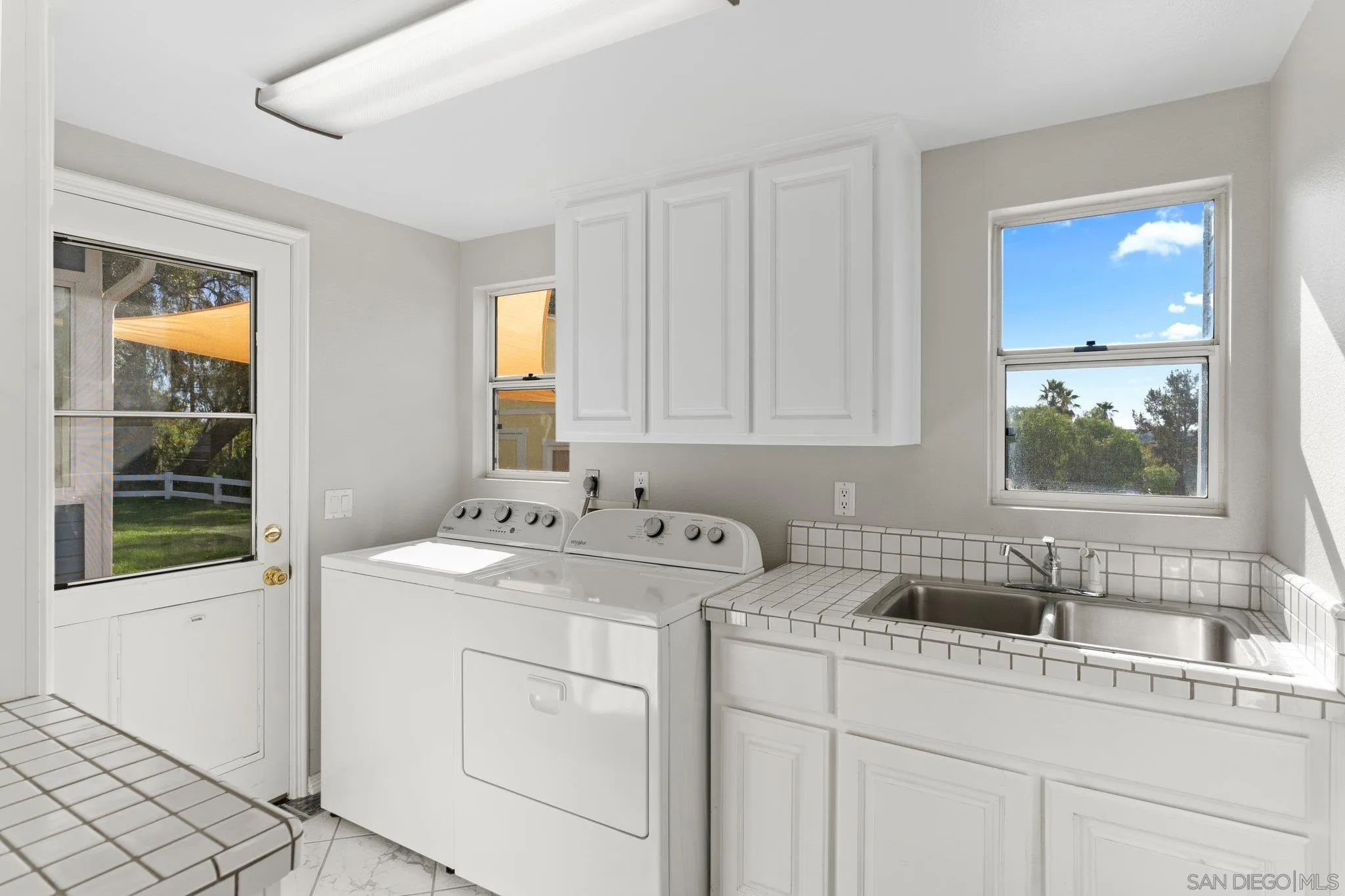 1267 Palomino Road Fallbrook, CA 92028 - Photo 25 of 34 a view of a sink and dishwasher with window