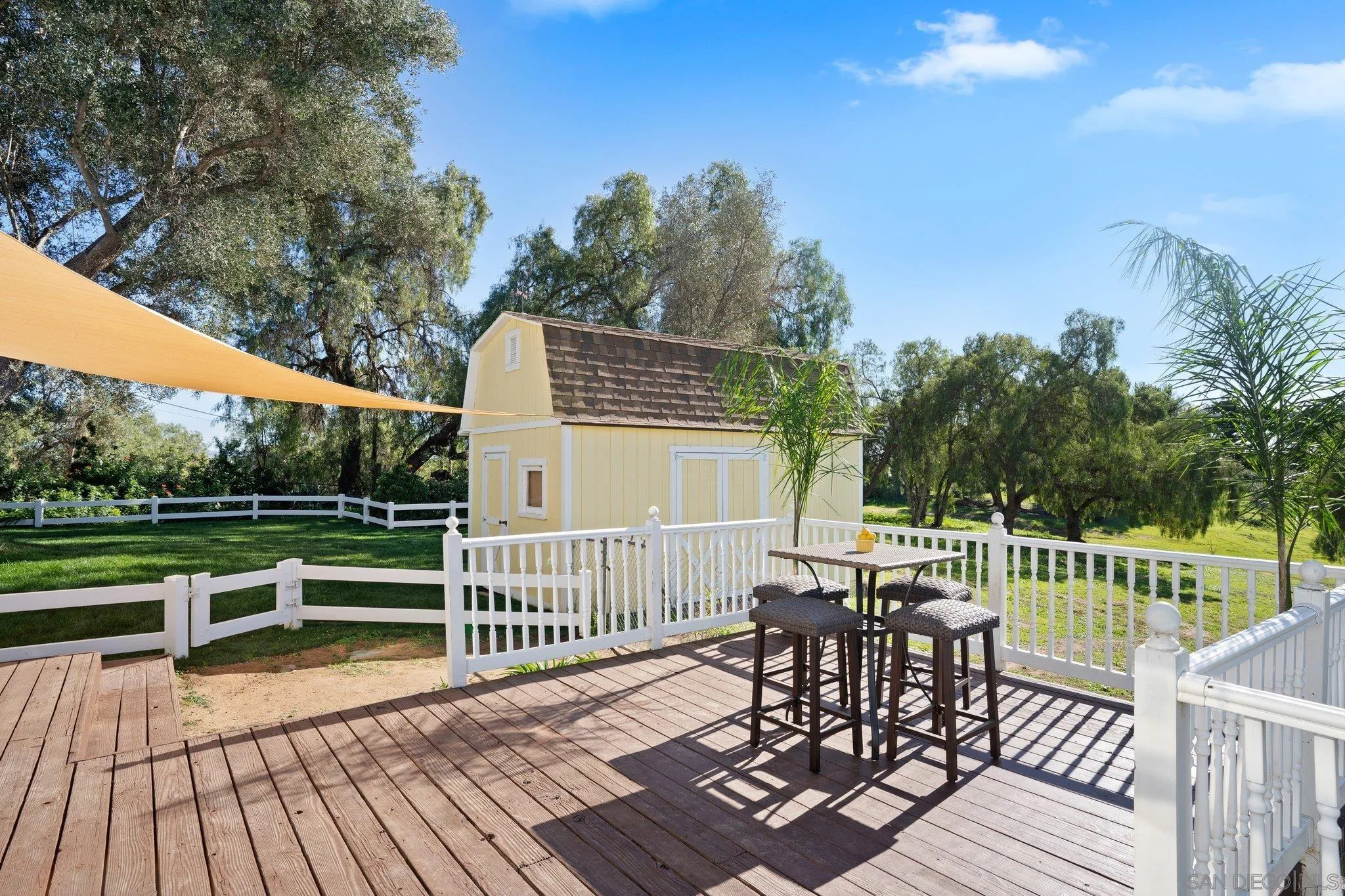1267 Palomino Road Fallbrook, CA 92028 - Photo 28 of 34 a view of a chairs and table on the wooden floor