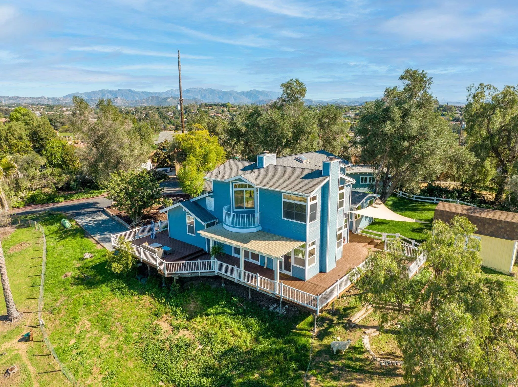 1267 Palomino Road Fallbrook, CA 92028 - Photo 4 of 34 a view of a house with a yard and sitting area