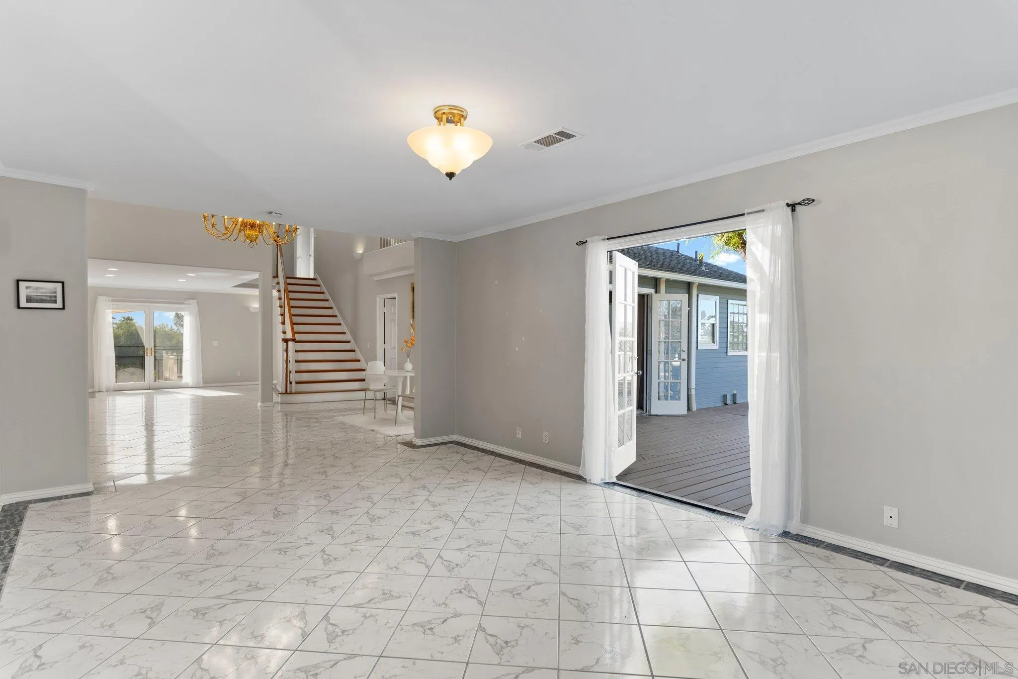 1267 Palomino Road Fallbrook, CA 92028 - Photo 7 of 34 an empty room with windows and pillars in it