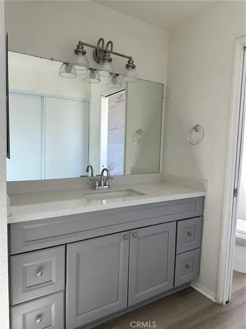 a bathroom with a double vanity sink and mirror
