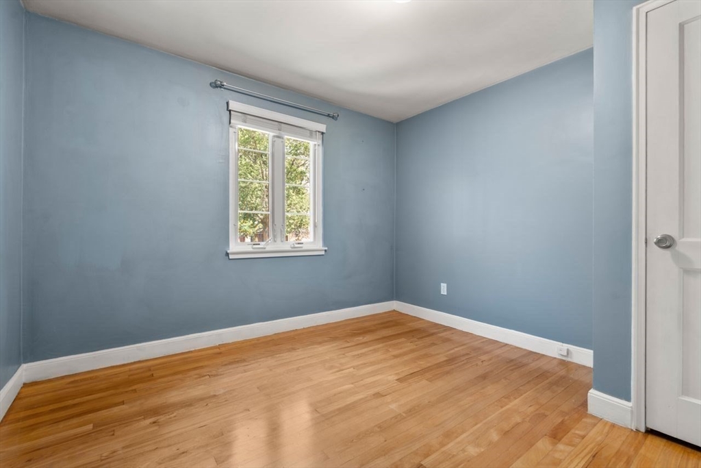 57 Pierce Road, Unit 57 Watertown, MA 02472 - Photo 15 of 22 a view of empty room with wooden floor