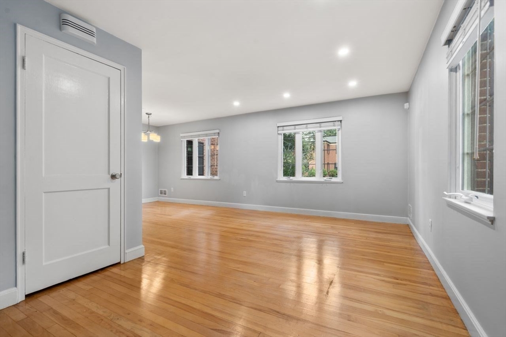 57 Pierce Road, Unit 57 Watertown, MA 02472 - Photo 9 of 22 a view of empty room with wooden floor and fan