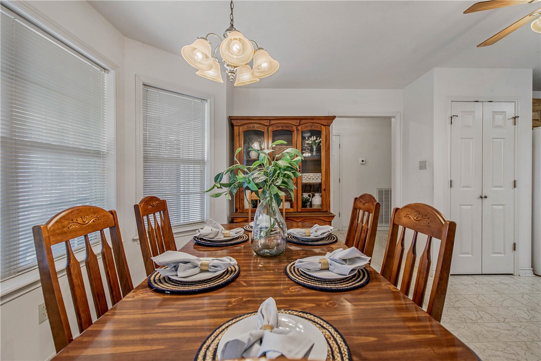1110 County Road 439 Dime Box, TX 77853 - Photo 16 of 50 a dining room with furniture wooden floor and a rug