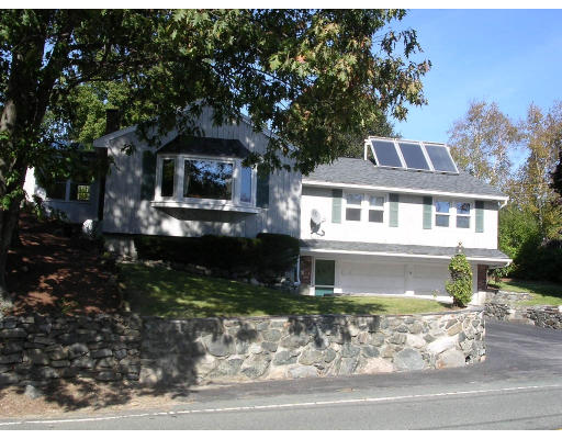 39 Locust Street Burlington, MA 01803 - Photo 1 of 5 a front view of a house with a yard