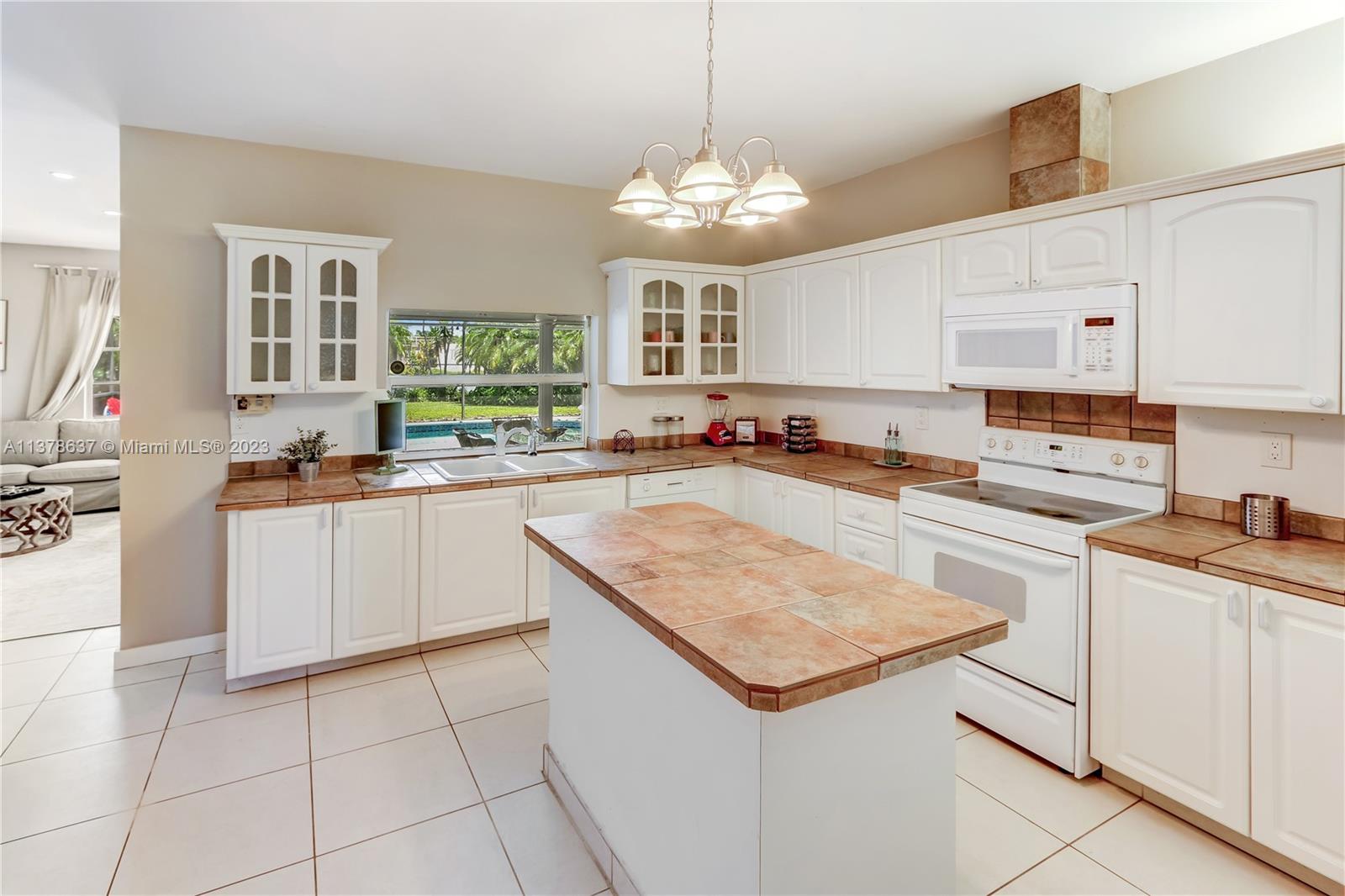 Bonaventure Lakes Weston, FL 33326 - Photo 12 of 52 a kitchen with stainless steel appliances granite countertop a sink stove and refrigerator