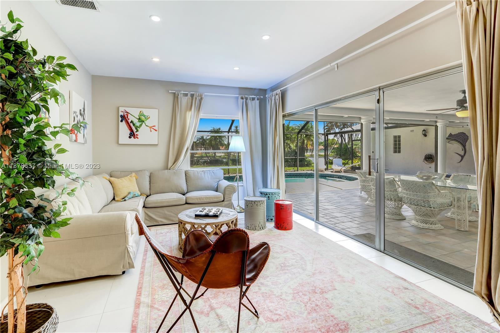 Bonaventure Lakes Weston, FL 33326 - Photo 13 of 52 a living room with furniture and a potted plant