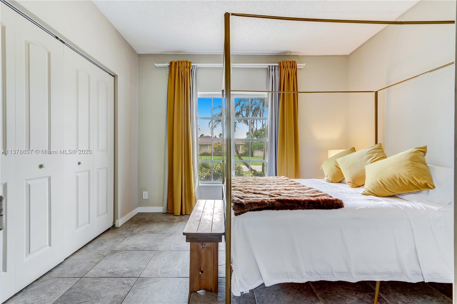 Bonaventure Lakes Weston, FL 33326 - Photo 22 of 52 a bedroom with a bed and large window