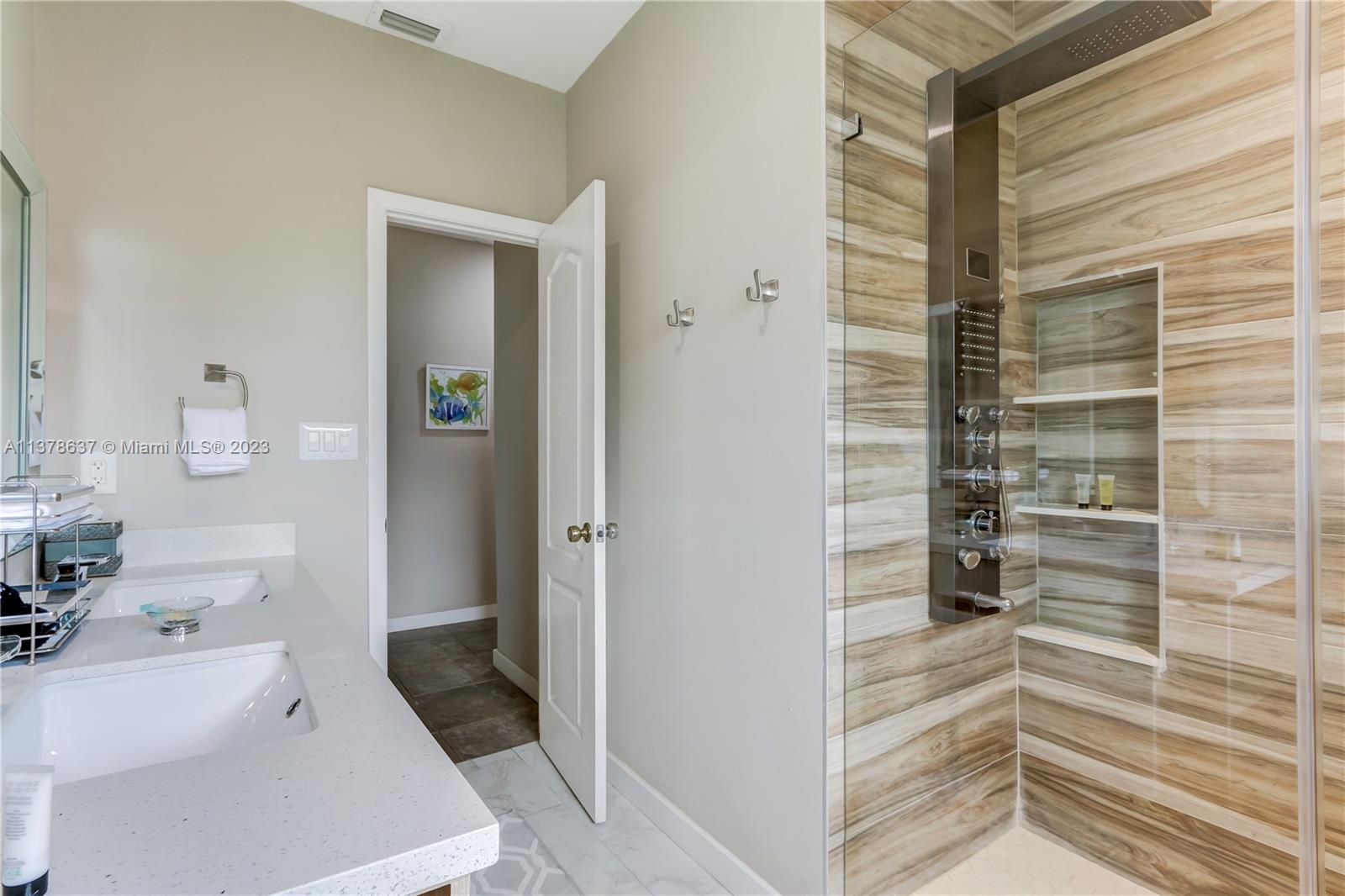 Bonaventure Lakes Weston, FL 33326 - Photo 24 of 52 a bathroom with a sink and a shower