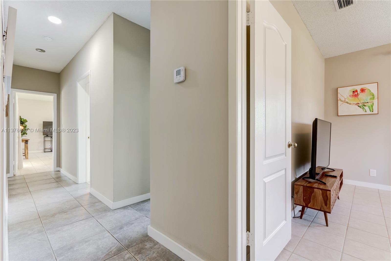 Bonaventure Lakes Weston, FL 33326 - Photo 26 of 52 a view of a workspace with furniture and a bathroom