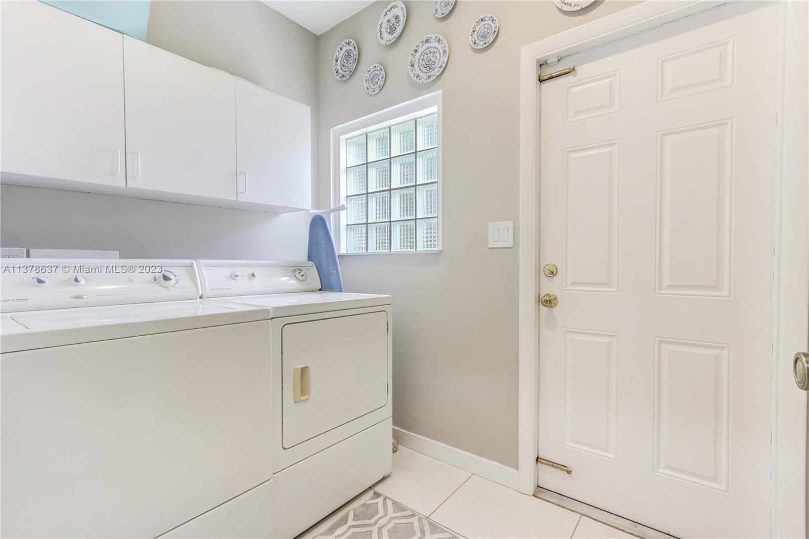 Bonaventure Lakes Weston, FL 33326 - Photo 28 of 52 a utility room with dryer and washer