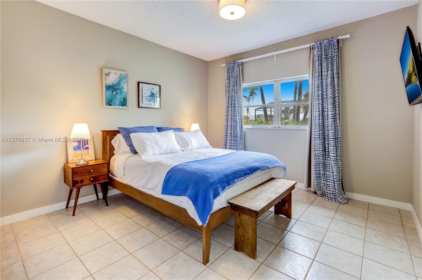 Bonaventure Lakes Weston, FL 33326 - Photo 33 of 52 a bedroom with a bed and a table in it