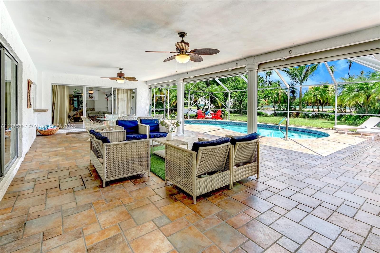 Bonaventure Lakes Weston, FL 33326 - Photo 40 of 52 a living room with patio furniture and a large window