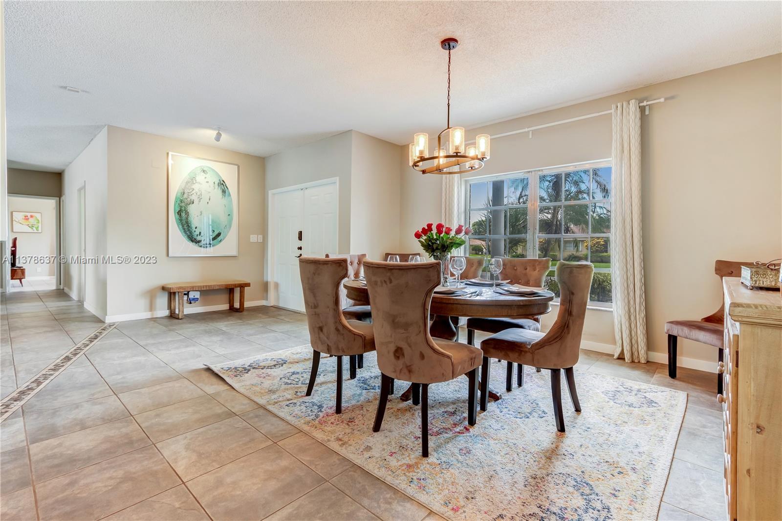 Bonaventure Lakes Weston, FL 33326 - Photo 5 of 52 a view of a dining room with furniture window and outside view