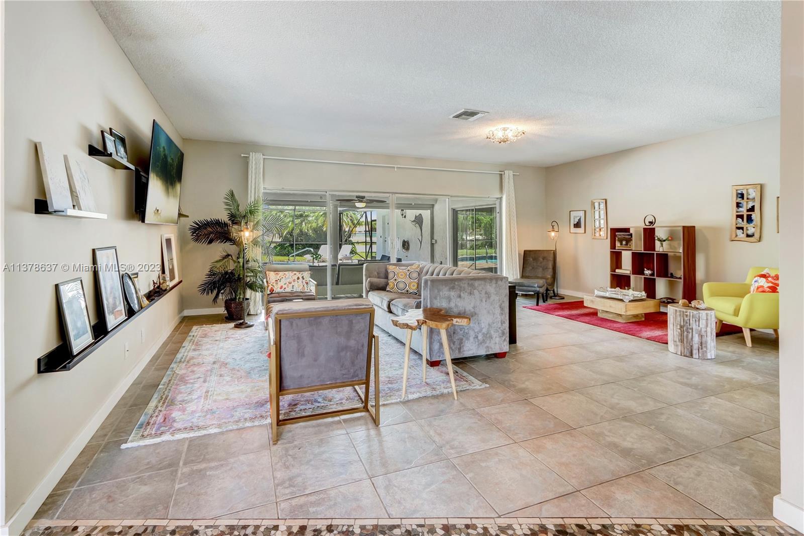 Bonaventure Lakes Weston, FL 33326 - Photo 7 of 52 a living room with furniture and a flat screen tv