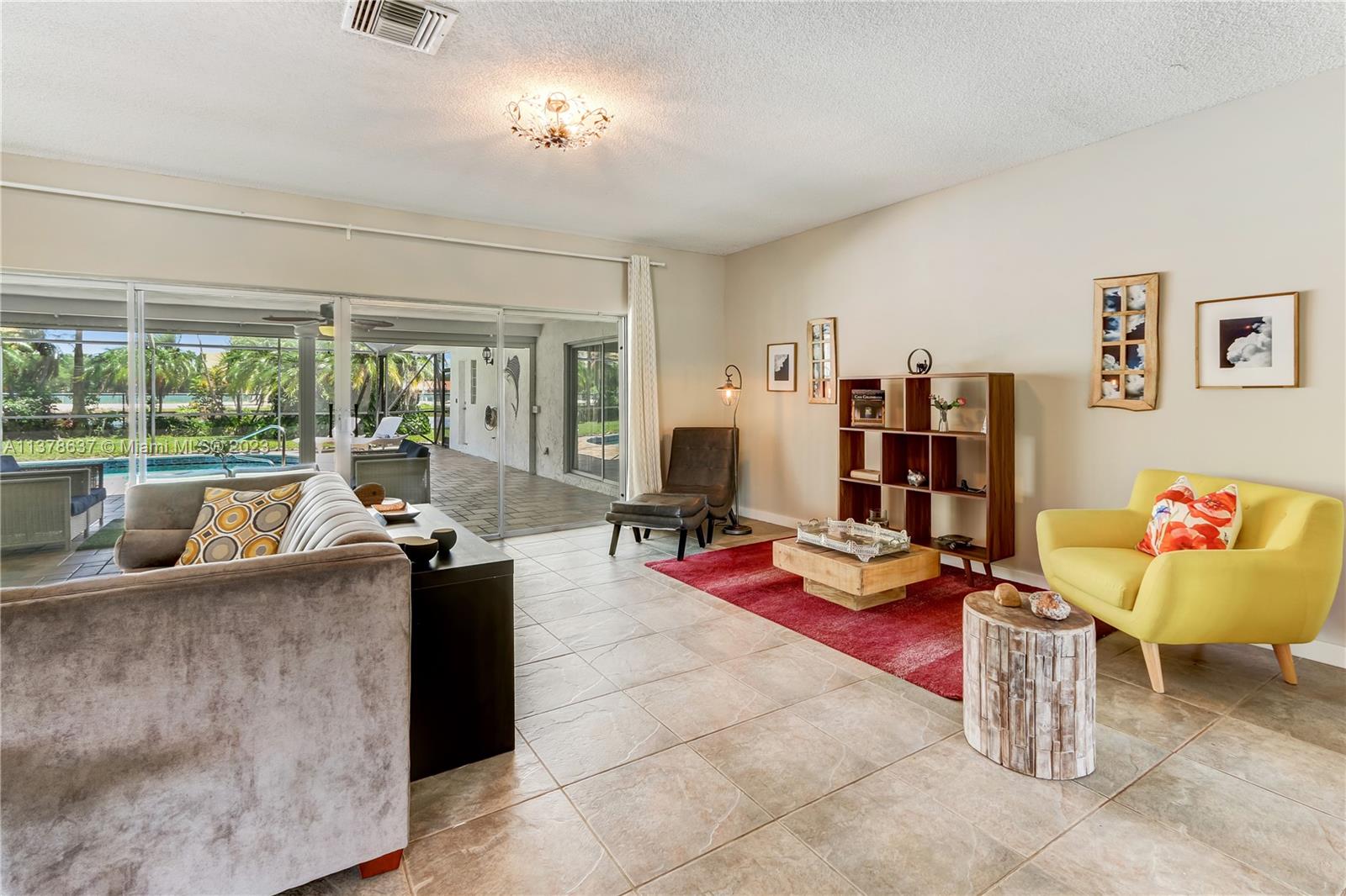 Bonaventure Lakes Weston, FL 33326 - Photo 8 of 52 a living room with furniture and a floor to ceiling window