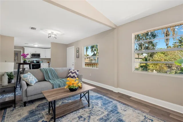 a living room with furniture and a window