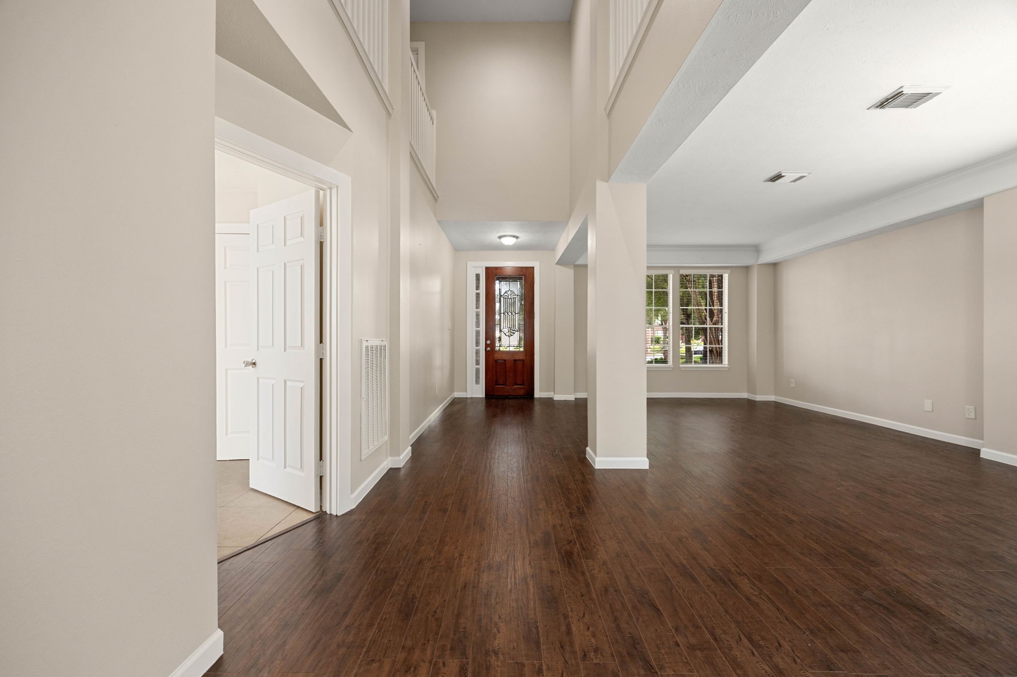 6335 Borg Breakpoint Drive Spring, TX 77379 - Photo 12 of 39 Spacious interior hallway with beautiful wood flooring and neutral finishes throughout.