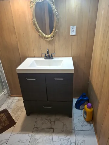 a bathroom with a sink and a mirror