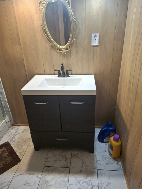 333 Lynnfield Street Lynn, MA 01904 - Photo 11 of 23 a bathroom with a sink and a mirror