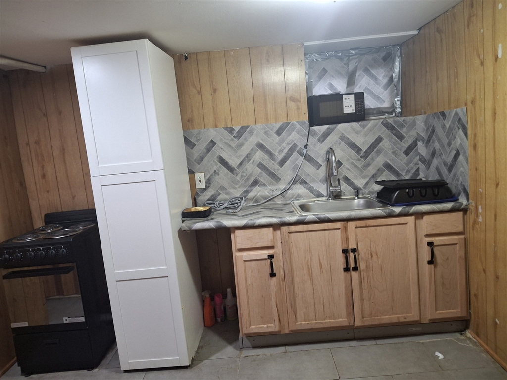 333 Lynnfield Street Lynn, MA 01904 - Photo 3 of 23 a close view of a sink a washer and dryer