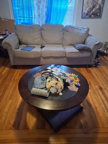 a living room with furniture and a rug
