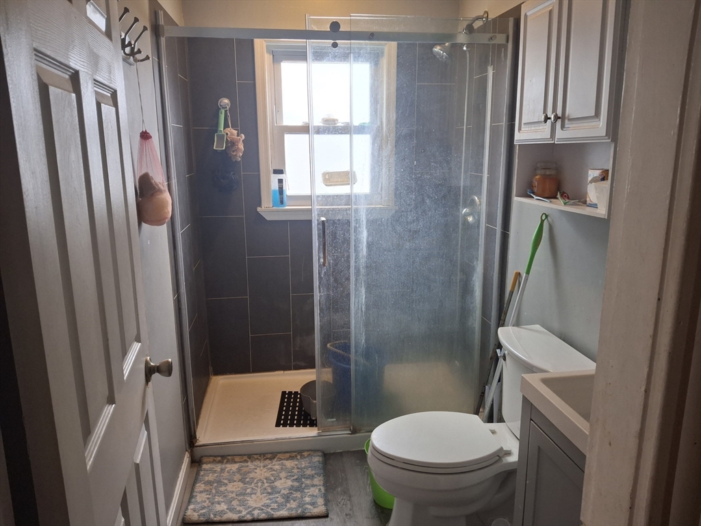 333 Lynnfield Street Lynn, MA 01904 - Photo 10 of 23 a bathroom with a toilet and a shower