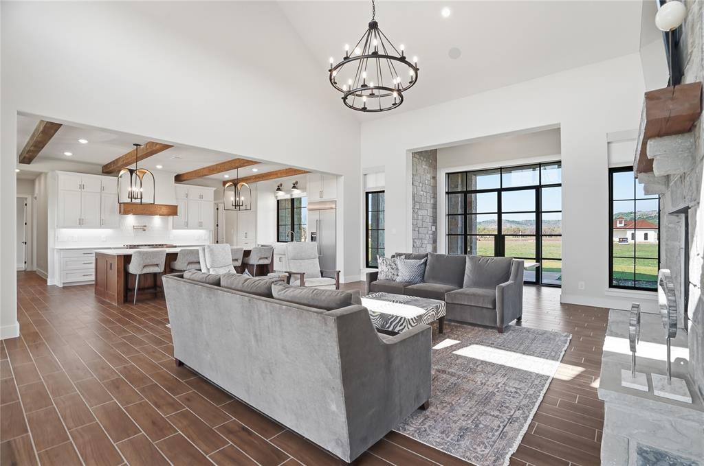 1010 Ranger Ridge Way Strawn, TX 76475 - Photo 11 of 40 a living room with furniture and a large window