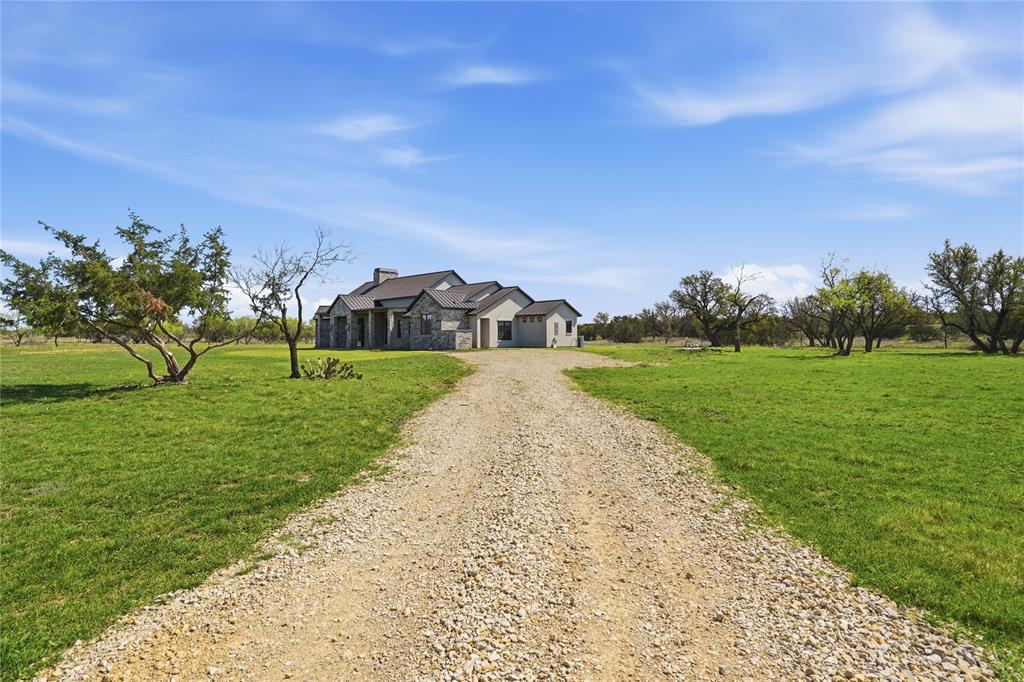 1010 Ranger Ridge Way Strawn, TX 76475 - Photo 2 of 40 a view of a park with large trees