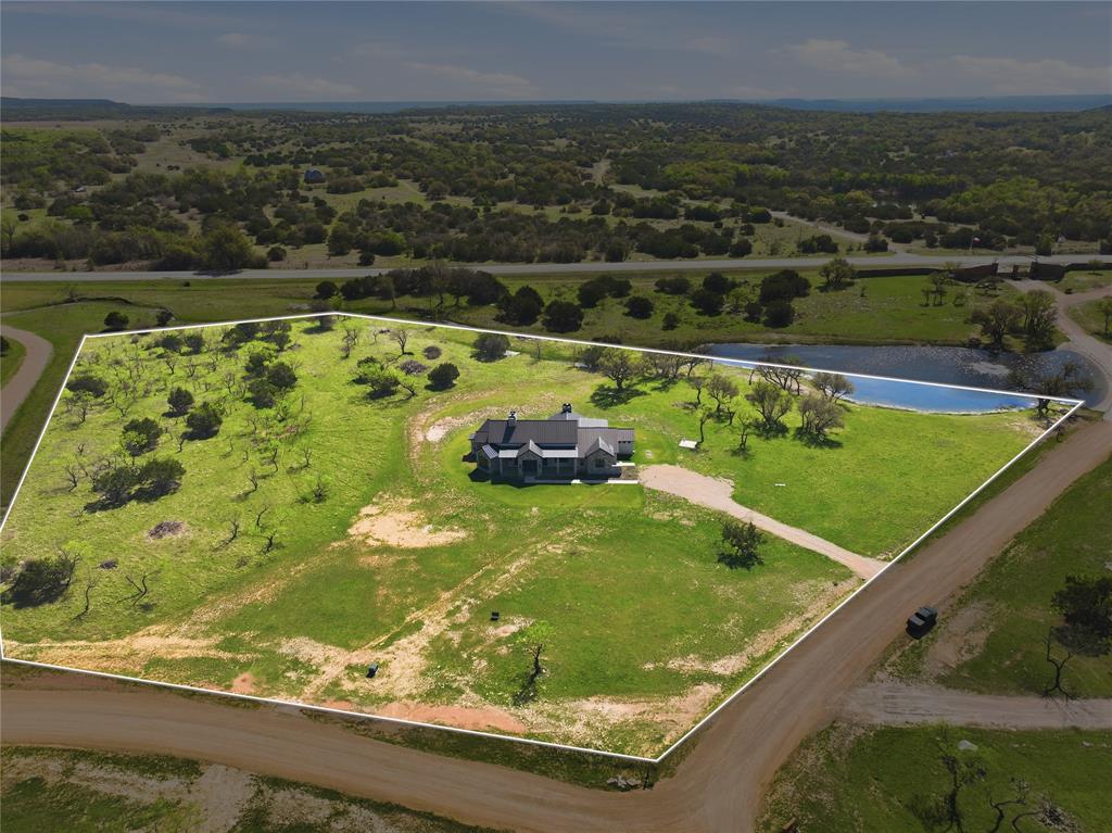 1010 Ranger Ridge Way Strawn, TX 76475 - Photo 3 of 40 a view of a pool